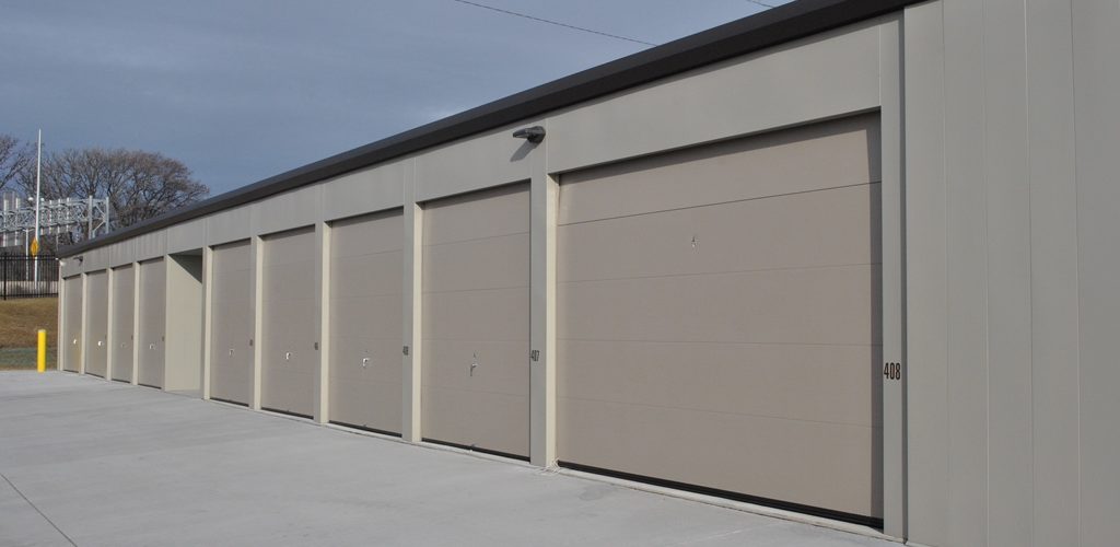 Climate controlled unit exterior with insulated sectional doors.