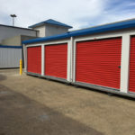 Micro units are used on a self-storage site to take advantage of paved areas outside. These micro units have patriot red doors and royal blue trim. 