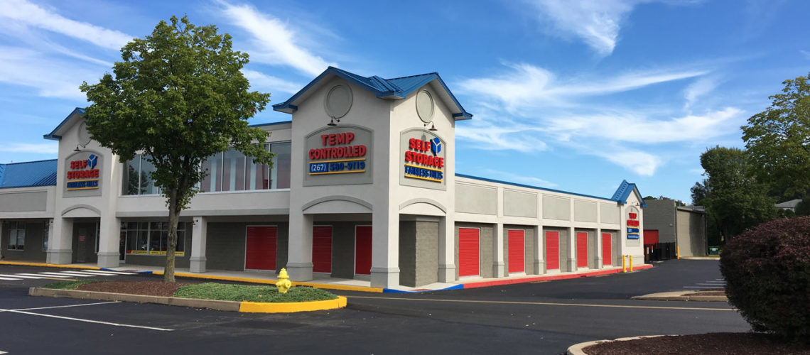 With a structure formerly serving as a Wal-Mart, this conversion property features faux doors and a second story door bank behind glass for greater visibility. Patriot red doors are used throughout the property.