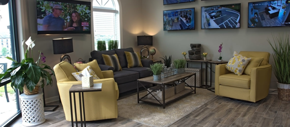 The office includes a comfortable waiting area with television and security camera monitors.