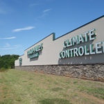 Large lettering helps identify the property which is set back significantly from the highway. The sign communicates that climate controlled storage is available.