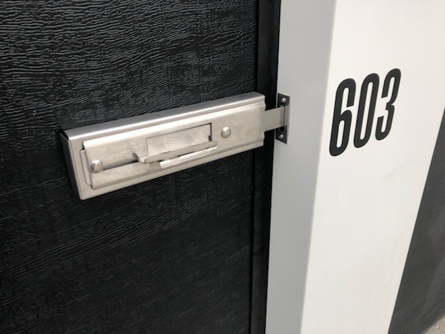 Trachte provides latch hardware for the sectional doors by others to accommodate two padlocks. 