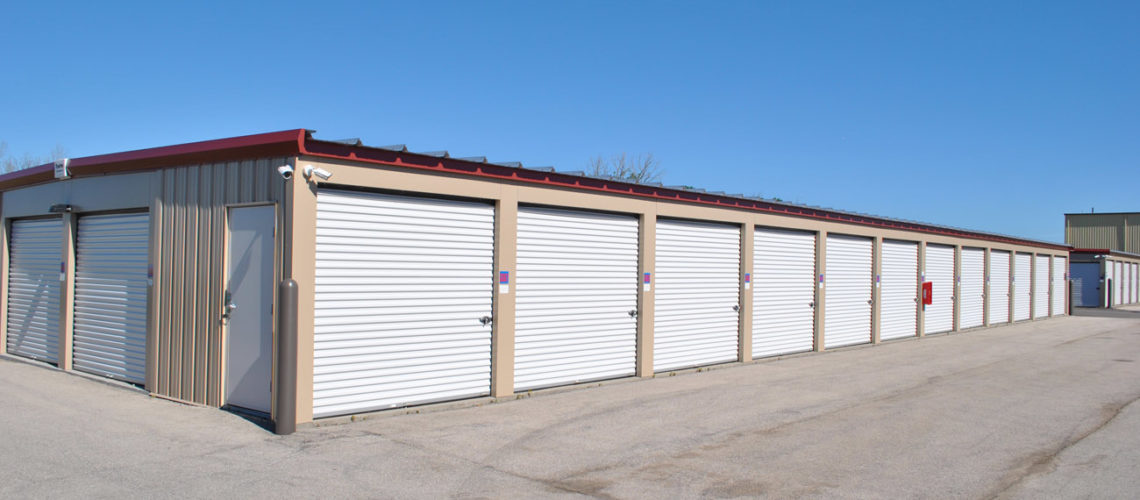 The site also includes many of Trachte's standard size storage units. The buildings are classic beige with iced white doors and cedar red trim.