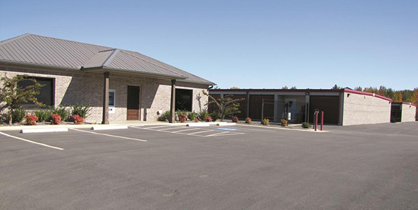 This facility has a mix of insulated and non-insulated slate gray self-storage buildings with garnet trim and doors.