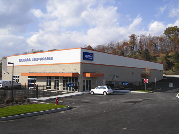 Two-story block perimeter self-storage building with a built-up roof.