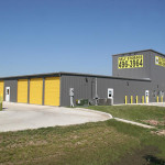 Insulated, non-insulated and boat/RV charcoal self-storage buildings with charcoal trim and yellow doors.