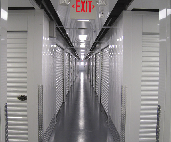 Bright white corridor system for a climate controlled self-storage facility.