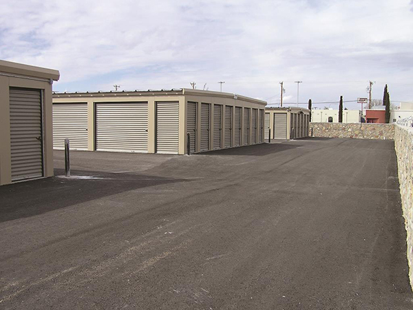 Classic beige self-storage buildings with shale doors.