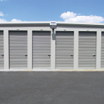 Slate gray self-storage building with shale doors.