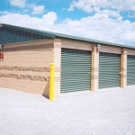 Contrasting block is used on this self-storage facility. The end wall metal panel is color matched to the evergreen roof instead of the block side walls.