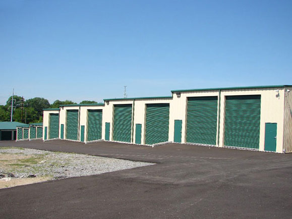 This project features evergreen roll up doors. The building is stepped to follow the grade changes, and includes walk doors for easy access to units. The large doors can be equipped with chain hoists for operation from within the storage unit.